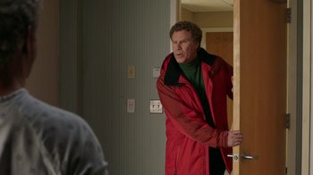 Movie still from “Daddy's Home 2” (2017), directed by Sean Anders – A man in a red coat standing in front of a door; Medium shot, Over the shoulder angle