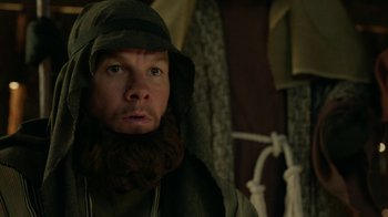 Movie still from “Daddy's Home 2” (2017), directed by Sean Anders – A person with a beard wearing a hood; Close Up shot, Over the shoulder angle