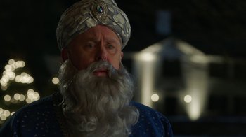 Movie still from “Daddy's Home 2” (2017), directed by Sean Anders – A man with a beard and a turban on; Close Up shot, Over the shoulder angle