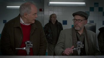 Movie still from “Daddy's Home 2” (2017), directed by Sean Anders – Two older men are talking in a bathroom; Medium shot, Over the shoulder angle