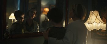 Movie still from “Daniel Isn't Real” (2019), directed by Adam Egypt Mortimer – A woman and a child looking in a mirror; Medium shot, Over the shoulder angle