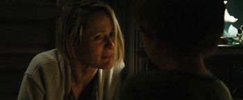 Movie still from “Daniel Isn't Real” (2019), directed by Adam Egypt Mortimer – A woman looking at another woman in a dark room; Close Up shot, Over the shoulder angle