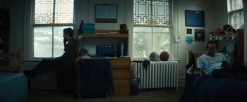 Movie still from “Daniel Isn't Real” (2019), directed by Adam Egypt Mortimer – A room with a desk , a chair and a radiator; Wide shot, Low angle
