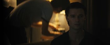Movie still from “Daniel Isn't Real” (2019), directed by Adam Egypt Mortimer – A man in a black shirt is in the dark; Close Up shot, Over the shoulder angle