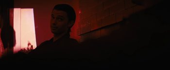 Movie still from “Daniel Isn't Real” (2019), directed by Adam Egypt Mortimer – A man standing in front of a brick wall; Close Up shot, Low angle