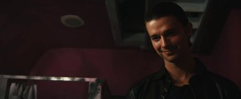 Movie still from “Daniel Isn't Real” (2019), directed by Adam Egypt Mortimer – A person wearing a leather jacket; Close Up shot, Over the shoulder angle
