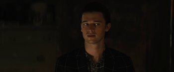 Movie still from “Daniel Isn't Real” (2019), directed by Adam Egypt Mortimer – A young man in a black shirt is looking at the camera; Close Up shot, Low angle