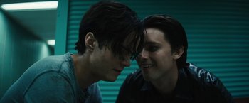 Movie still from “Daniel Isn't Real” (2019), directed by Adam Egypt Mortimer – Two young men looking at one another in a room; Close Up shot, Over the shoulder angle