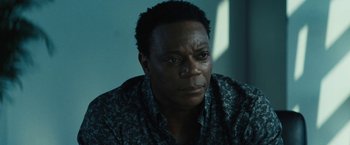 Movie still from “Daniel Isn't Real” (2019), directed by Adam Egypt Mortimer – A person wearing a shirt; Close Up shot, Over the shoulder angle