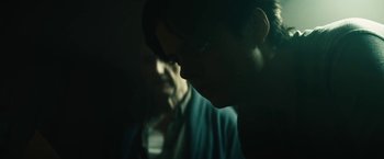 Movie still from “Daniel Isn't Real” (2019), directed by Adam Egypt Mortimer – A blurry picture of a man and a woman; Close Up shot, Over the shoulder angle