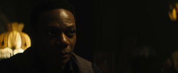 Movie still from “Daniel Isn't Real” (2019), directed by Adam Egypt Mortimer – A man's face in the dark; Close Up shot, Low angle