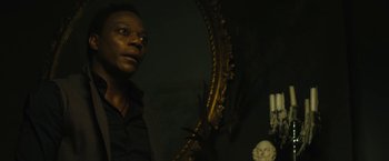 Movie still from “Daniel Isn't Real” (2019), directed by Adam Egypt Mortimer – A man looking at himself in a mirror; Close Up shot, Low angle