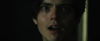 Movie still from “Daniel Isn't Real” (2019), directed by Adam Egypt Mortimer – A person's eyes and face; Close Up shot, Low angle