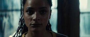 Movie still from “Daniel Isn't Real” (2019), directed by Adam Egypt Mortimer – A woman's face in front of a window; Close Up shot, Low angle