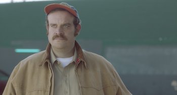 Movie still from “Flower” (2017), directed by Max Winkler – A person wearing a hat; Close Up shot, Low angle