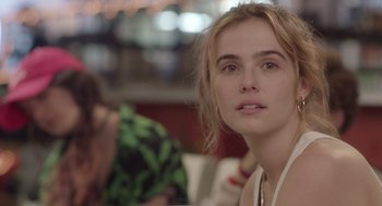 Movie still from “Flower” (2017), directed by Max Winkler – A person sitting at a table; Close Up shot, Over the shoulder angle