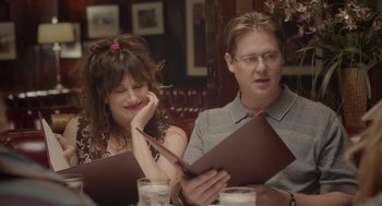 Movie still from “Flower” (2017), directed by Max Winkler – A man and a woman sitting at a table with a menu; Close Up shot, Over the shoulder angle