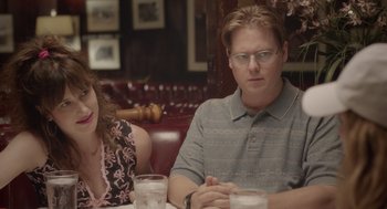 Movie still from “Flower” (2017), directed by Max Winkler – A man and a woman sitting at a table in a restaurant; Medium shot, Over the shoulder angle