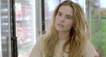 Movie still from “Flower” (2017), directed by Max Winkler – A beautiful young woman with long , blonde hair; Close Up shot, Over the shoulder angle