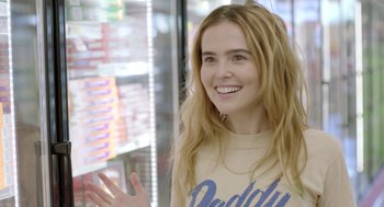 Movie still from “Flower” (2017), directed by Max Winkler – A woman with long blonde hair is smiling; Close Up shot, Over the shoulder angle
