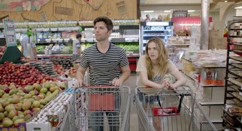 Movie still from “Flower” (2017), directed by Max Winkler – A man and a woman in a grocery store with shopping trolleys; Medium shot, Over the shoulder angle