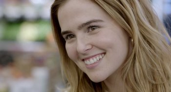 Movie still from “Flower” (2017), directed by Max Winkler – A woman's face smiling; Close Up shot, Over the shoulder angle