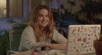Movie still from “Flower” (2017), directed by Max Winkler – A woman sitting in front of a laptop computer; Close Up shot, Over the shoulder angle