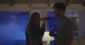 Movie still from “Flower” (2017), directed by Max Winkler – A man and a woman are drinking beer together; Medium shot, Over the shoulder angle