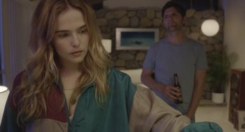 Movie still from “Flower” (2017), directed by Max Winkler – A woman sitting in front of a man holding a beer; Close Up shot, Over the shoulder angle
