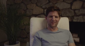 Movie still from “Flower” (2017), directed by Max Winkler – A man sitting in a chair with his eyes wide open; Close Up shot, Over the shoulder angle