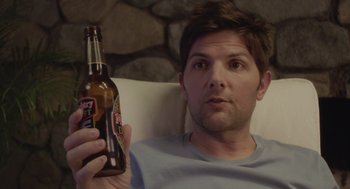 Movie still from “Flower” (2017), directed by Max Winkler – A person holding a bottle of beer; Close Up shot, Over the shoulder angle