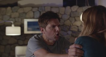 Movie still from “Flower” (2017), directed by Max Winkler – A young man holding a video game controller in his hand; Close Up shot, Over the shoulder angle
