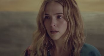 Movie still from “Flower” (2017), directed by Max Winkler – A person with long blonde hair; Close Up shot, Over the shoulder angle