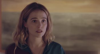 Movie still from “Flower” (2017), directed by Max Winkler – A young woman is looking into the distance; Close Up shot, Over the shoulder angle