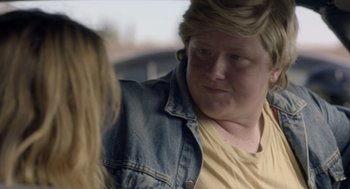 Movie still from “Flower” (2017), directed by Max Winkler – A woman with blonde hair is sitting next to another woman; Close Up shot, Over the shoulder angle