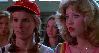 Movie still from “De Palma” (2015), directed by Jake Paltrow – A group of young women standing next to each other in a room; Close Up shot, Low angle