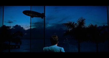 Movie still from “De Palma” (2015), directed by Jake Paltrow – A man sitting in front of a window at night; Extreme Wide shot, Low angle