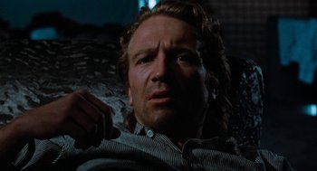 Movie still from “De Palma” (2015), directed by Jake Paltrow – A person sitting in a chair; Close Up shot, Low angle