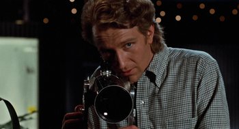 Movie still from “De Palma” (2015), directed by Jake Paltrow – A man taking a picture with a camera; Close Up shot, Low angle