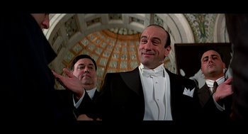 Movie still from “De Palma” (2015), directed by Jake Paltrow – Two men dressed in formal wear posing for a picture; Medium shot, Low angle