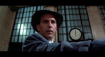 Movie still from “De Palma” (2015), directed by Jake Paltrow – A man wearing a hat and a blanket; Close Up shot, Low angle