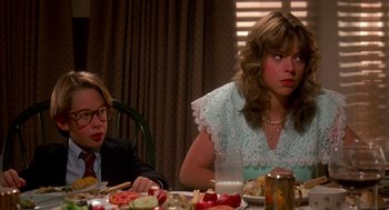 Movie still from “De Palma” (2015), directed by Jake Paltrow – Two people sitting at a dinner table with food; Medium shot, Over the shoulder angle