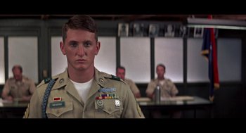 Movie still from “De Palma” (2015), directed by Jake Paltrow – A man in a military uniform standing in front of a group of people; Close Up shot, Low angle