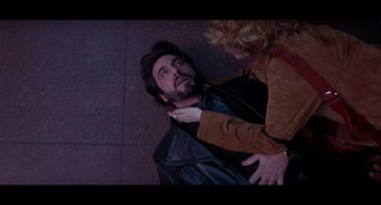Movie still from “De Palma” (2015), directed by Jake Paltrow – A man and a woman on the ground; Medium shot, Overhead angle