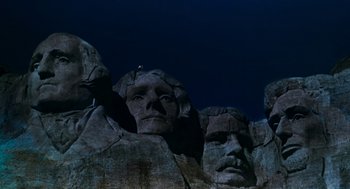 Movie still from “De Palma” (2015), directed by Jake Paltrow – A group of statues that are in the dark; Extreme Wide shot, Low angle