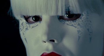 Movie still from “De Palma” (2015), directed by Jake Paltrow – A woman's face with white makeup; Extreme Close Up shot, Overhead angle