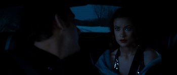 Movie still from “Deadfall” (2012), directed by Stefan Ruzowitzky – A man and a woman sitting in the back of a car at night; Close Up shot, Over the shoulder angle