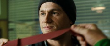 Movie still from “Deadfall” (2012), directed by Stefan Ruzowitzky – A person wearing a hat; Close Up shot, Low angle