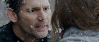 Movie still from “Deadfall” (2012), directed by Stefan Ruzowitzky – A person looking at another person through a window; Close Up shot, Over the shoulder angle