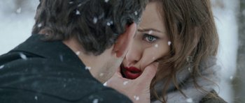 Movie still from “Deadfall” (2012), directed by Stefan Ruzowitzky – A man and a woman kissing in the snow; Extreme Close Up shot, Over the shoulder angle